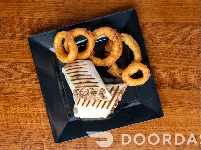 Smashed Beef Wrap with Onion Rings.